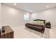 Cozy bedroom featuring light wood floors, a plush bed, and a decorative rug at 1063 Sandstone Cir, Erie, CO 80516