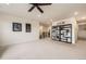 Upstairs bonus room with neutral carpet, recessed lighting, stairs and black metal railing at 1063 Sandstone Cir, Erie, CO 80516