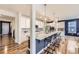 Beautiful kitchen with white cabinets, granite countertops, and bar stool seating at 1063 Sandstone Cir, Erie, CO 80516