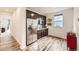 The kitchenette features stainless steel appliances, granite countertops, and wood-look flooring at 1063 Sandstone Cir, Erie, CO 80516