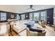 Spacious living room with hardwood floors, modern decor, and ample natural light at 1063 Sandstone Cir, Erie, CO 80516