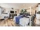 Open layout featuring a dining area and living space with modern decor and ample natural light at 1063 Sandstone Cir, Erie, CO 80516