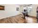 Home office with a modern desk, chair, and ample natural light at 1063 Sandstone Cir, Erie, CO 80516