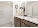 Clean bathroom features a double vanity, framed mirrors, and coordinated decor at 3347 Belleville Ridge Rd, Elizabeth, CO 80107