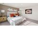 Sunlit bedroom showcasing modern accents, soft carpet, and a decorative wall accent at 3347 Belleville Ridge Rd, Elizabeth, CO 80107