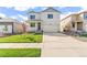 Charming home with a two-car garage, a cozy front porch, and a well-manicured lawn at 3347 Belleville Ridge Rd, Elizabeth, CO 80107