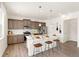 Beautiful kitchen featuring stainless steel appliances, gray cabinets, and a white countertop island with stool seating at 3347 Belleville Ridge Rd, Elizabeth, CO 80107