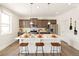 Beautiful kitchen featuring stainless steel appliances, gray cabinets, and a white countertop island with stool seating at 3347 Belleville Ridge Rd, Elizabeth, CO 80107