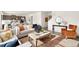 Bright and airy living room with stylish decor, hardwood floors, and comfortable seating arrangements at 3347 Belleville Ridge Rd, Elizabeth, CO 80107