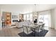 Spacious living area featuring dining table, fireplace and view into living room at 3347 Belleville Ridge Rd, Elizabeth, CO 80107