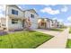 Neighborhood street view showing the home's facade, landscaped lawn, and a well-kept sidewalk at 3347 Belleville Ridge Rd, Elizabeth, CO 80107