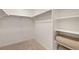 Walk-in closet providing ample storage space with shelving and a hanging rod at 3347 Belleville Ridge Rd, Elizabeth, CO 80107