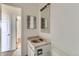 Bathroom with vanity and medicine cabinet, offering functionality in a compact space at 13621 E Center Ave, Aurora, CO 80012