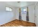 Bedroom with hardwood floors, natural light, and a neutral palette, offering a blank canvas for personalization at 13621 E Center Ave, Aurora, CO 80012