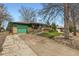 Ranch home featuring an attached garage, a ramp, and mature trees on a well-kept lawn at 13621 E Center Ave, Aurora, CO 80012