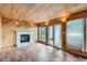 Sun room with tile floor and fireplace creating a warm atmosphere, with natural light at 13621 E Center Ave, Aurora, CO 80012