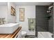 Bathroom with a wood countertop, modern sink, and elegant fixtures at 20 S Harlan St, Lakewood, CO 80226