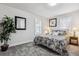Cozy bedroom featuring a comfortable queen size bed and two bedside lamps at 20 S Harlan St, Lakewood, CO 80226