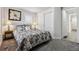 Comfortable bedroom featuring a queen-sized bed, soft carpet, and closet at 20 S Harlan St, Lakewood, CO 80226