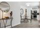 Cozy dining area featuring a glass table and seating adjacent to the kitchen at 20 S Harlan St, Lakewood, CO 80226