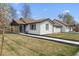 Beautiful home with a well-kept lawn and charming architecture on a sunny day at 20 S Harlan St, Lakewood, CO 80226