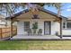 Inviting front porch with a covered entrance and decorative plants and seating at 20 S Harlan St, Lakewood, CO 80226