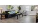 Bright living room with a gray sofa, stylish decor, and wood floors for a modern touch at 20 S Harlan St, Lakewood, CO 80226