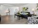 Stylish living room with wood floors, a gray sofa, and an open layout, perfect for entertaining at 20 S Harlan St, Lakewood, CO 80226