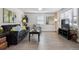 Cozy living room with modern furnishings, hardwood floors, and natural light from the windows at 20 S Harlan St, Lakewood, CO 80226