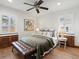 Inviting bedroom featuring a comfortable bed and hardwood floors and natural light at 2535 Leyden St, Denver, CO 80207