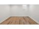 Clean bedroom with wood flooring, and a window bringing in natural light at 2535 Leyden St, Denver, CO 80207