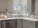 Contemporary kitchen featuring sleek countertops, mosaic backsplash, and modern fixtures offering a stylish and functional space at 2535 Leyden St, Denver, CO 80207