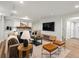 Basement living room featuring a stone fireplace, comfortable seating, and entertainment center at 2535 Leyden St, Denver, CO 80207
