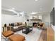 Cozy living room with a stone fireplace, plush sofa, modern furniture, and recessed lighting at 2535 Leyden St, Denver, CO 80207