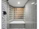 Modern bathroom features a sleek shower with glass block accent wall and stylish tile work at 2535 Leyden St, Denver, CO 80207