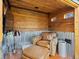 Comfortable sitting area with wood paneling, tin wainscoting, leather chair and TV for relaxing indoors at 2535 Leyden St, Denver, CO 80207