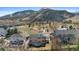 The aerial shot presents the backyard with a deck in a neighborhood that is near a park at 1304 5Th St, Golden, CO 80403