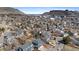 An aerial view showcases a neighborhood nestled in the valley surrounded by scenic mountain views at 1304 5Th St, Golden, CO 80403