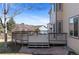 A partially-covered back deck overlooks a landscaped yard, ideal for outdoor entertaining or relaxing with mountain views at 1304 5Th St, Golden, CO 80403