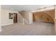 Open basement layout features durable carpet and a unique rock climbing wall at 1304 5Th St, Golden, CO 80403