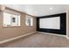 Finished basement with plush carpeting and a projector screen for entertainment at 1304 5Th St, Golden, CO 80403