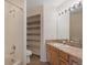Bright bathroom features shower, vanity with granite countertops, and convenient built-in shelving at 1304 5Th St, Golden, CO 80403
