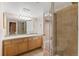 Bathroom with double sink vanity and a glass-enclosed shower at 1304 5Th St, Golden, CO 80403