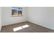 Cozy bedroom with natural light streaming through a large window, neutral walls and plush carpeting at 1304 5Th St, Golden, CO 80403