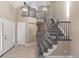 Grand entryway with staircase, tile flooring and neutral walls offers an inviting space at 1304 5Th St, Golden, CO 80403