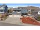 Charming two-story home boasts a brick and siding exterior, two-car garage, and landscaped front yard at 1304 5Th St, Golden, CO 80403