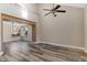 Open living room with vaulted ceiling, ceiling fan, and beautiful laminate flooring at 1304 5Th St, Golden, CO 80403