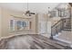 Bright living room featuring bay window, high ceiling, a stairway and stylish laminate flooring at 1304 5Th St, Golden, CO 80403