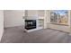 Living Room features a modern fireplace, built-in shelving, and large window offering ample natural light at 1304 5Th St, Golden, CO 80403