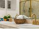 Close up of bathroom vanity and sink featuring stylish gold hardware and updated fixtures at 9016 W Alabama Pl, Lakewood, CO 80232